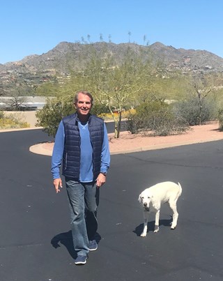 Bill Lavidge, President and CEO of LAVIDGE, takes his dog Joy for a walk during a virtual walk to benefit children with disabilities.