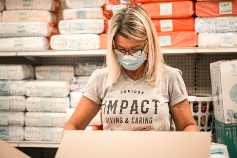EVP/CFO Sandra Torre sorts and repackages diapers for Harvest Compassion Center with LAVIDGE IMPACT in May 2021.