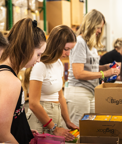 LAVIDGE Employees Pack School Supplies for Foster Kids