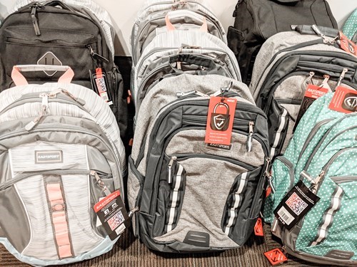 IMPACT Donates 20 Fully Stocked Backpacks for Kids